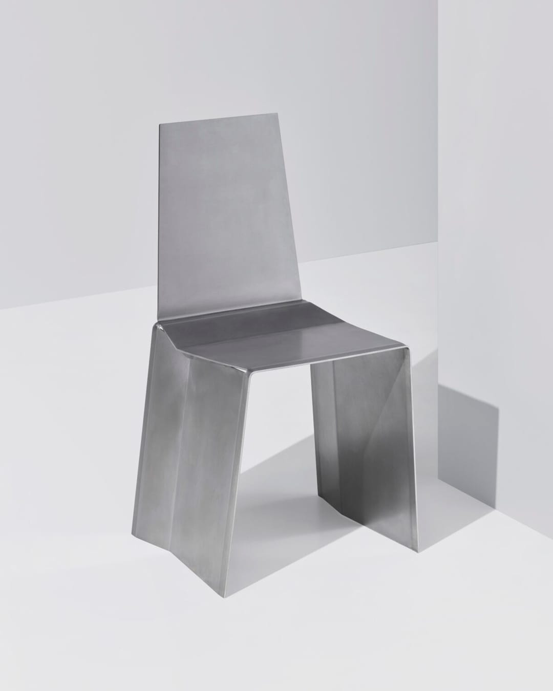 Paul Coenen folds single sheet of steel to form furniture pieces